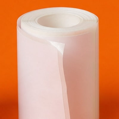 A roll of white sticker paper